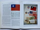 an open book with a picture of a flag and other things on it
