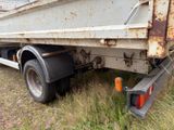 a white truck that is parked in the grass