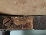 a close up of a piece of wood with a label on it