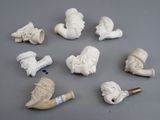 many different types of pipe heads and pipes on the table