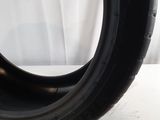 a close up of a tire tire on a white surface