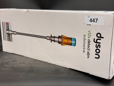 packaging for a new product of a vacuum cleaner on a table