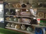 a shelf with many different items on it in a store