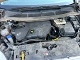 the engine of a car with its hood open and the hood open