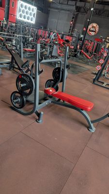 a picture of a gym with a lot of exercise equipment