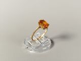 a close up of a gold ring with a citrine stone on it