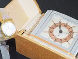 a watch sitting in a box with a watch inside of it