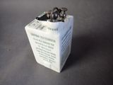 a small white box that has a bunch of screws in it