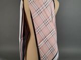 a pink and black plaid scarf on a mannequin mannequin mannequin mannequin mannequin mannequin mannequin mannequin