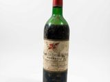 a bottle of wine that is sitting on a table