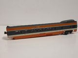 a toy train that is sitting on a white surface