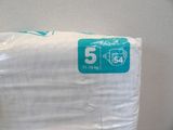 a stack of toilet paper sitting on top of a toilet
