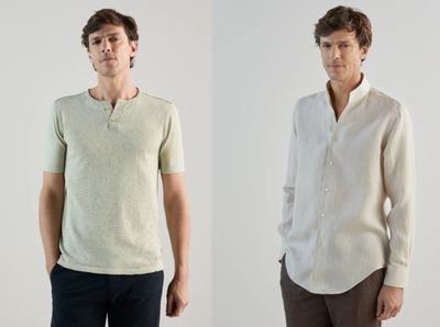 two men standing next to each other in a white shirt and black pants