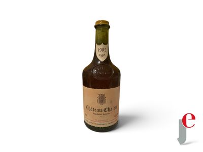 an image of a bottle of wine sitting on top of a white surface