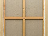 a close up of a picture of a window frame on a wall