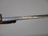 a close up of a metal object with writing on it