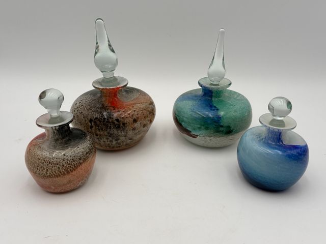 CRISTALLERIE PIERRE DE LUNE. Quatre flacons en verre multicouche ...