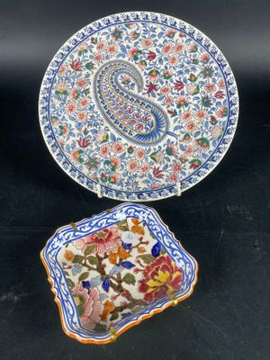 two plates and a small plate with a paisley design on them