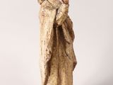 a statue of a woman with her hands folded in prayer