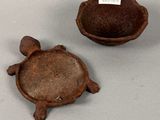 a small turtle shaped bowl and a small turtle shaped bowl