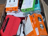 a box full of electronic devices sitting on a wooden table