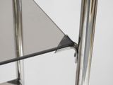 a glass shelf with a metal frame and a glass top