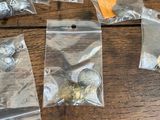 a lot of coins in the bags on the table