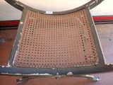 a chair that has a hole in the back of it