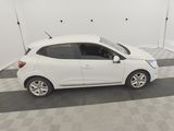 a picture of a small white car parked in a garage