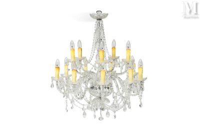 a close up of a chandelier with candles on it