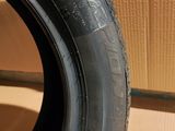 tire tread of a car on a cardboard box with a cardboard box in the background