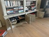 a book shelf that has a bunch of books on it