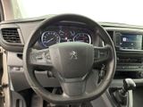 the interior of a car with a steering wheel and dashboard controls
