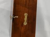 an old wooden door with a brass handle on a white background