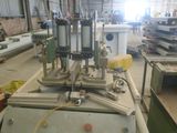 a machine that is sitting in a factory with a lot of machines