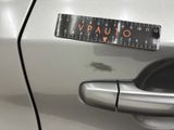 a sticker on the door handle of a car