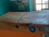 a wooden table with a piece of wood on top of it
