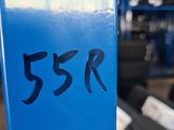 a close up of a blue sign with a number on it