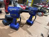 two electric tools that are sitting on a table