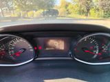 a close up of a car dashboard with a speedometer and gauges
