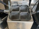 an image of a commercial deep fryer with four deep fryers