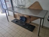 a metal table with a bag on top of it