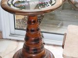 a small table with a glass top in a room