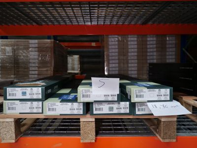 many boxes that are on a pallet in the warehouse