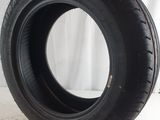 a close up of a tire on a white surface with a white background