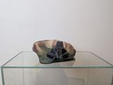 a glass table with a glass bowl on it