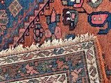 an image of a close up of a rug with a cat laying on it