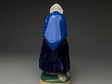 an image of a figurine of a woman in a blue dress