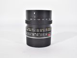 a close up of a camera lens on a white surface
