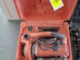 a tool in a case that is sitting on the floor